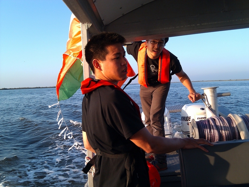 MIT graduate student Jeffrey Warren (right) prepares to launch a kite-borne camera from a boat in the Gulf of Mexico. 