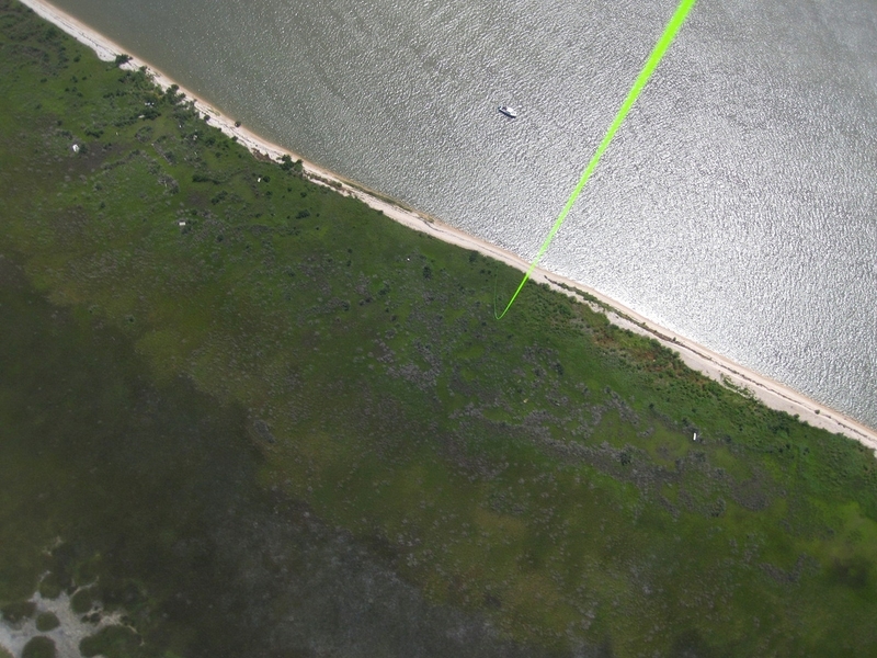 Image of Louisiana coastline taken by digital camera suspended from a balloon. The green line is the tether holding the balloon, which was launched from the boat seen at top center. 