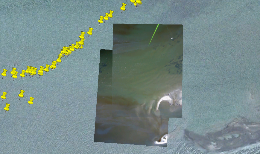 Using software developed by Jeffrey Warren, images can be stitched together and correctly oriented on a background image of the region. White areas are part of the Chandeleur Islands, and yellow push pins represent GPS readings taken for location reference.