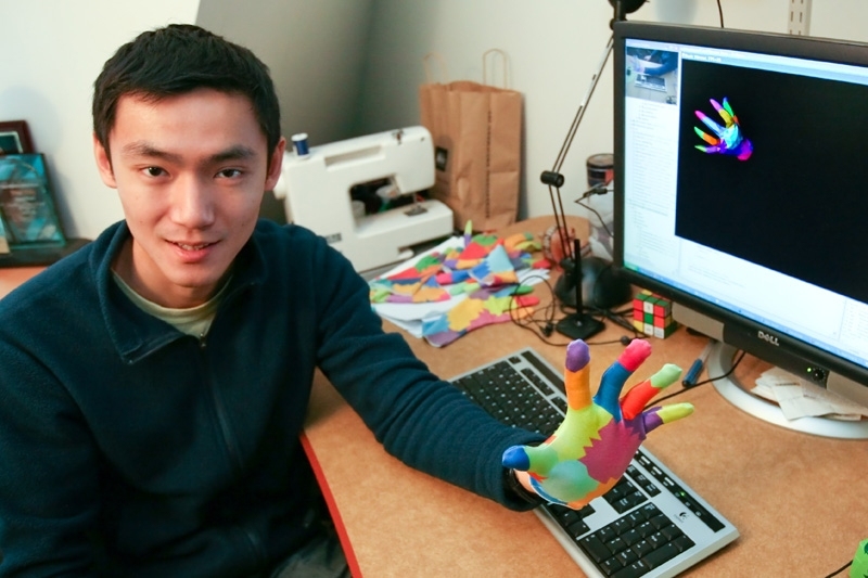 CSAIL graduate student Robert Wang shows off the new system, which he developed together with associate professor of electrical engineering and computer science Jovan Popović.