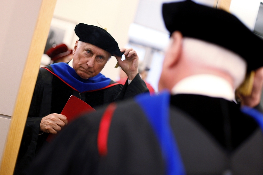 Raymond S. Stata ’57, the Commencement speaker, prepares for the exercises.