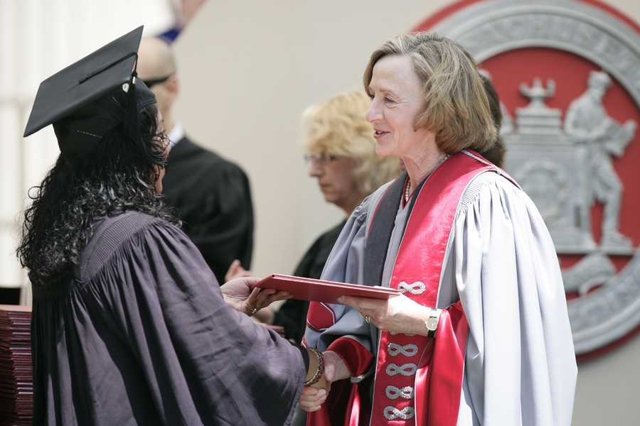 MIT President Susan Hockfield presents a diploma to one of the graduates.