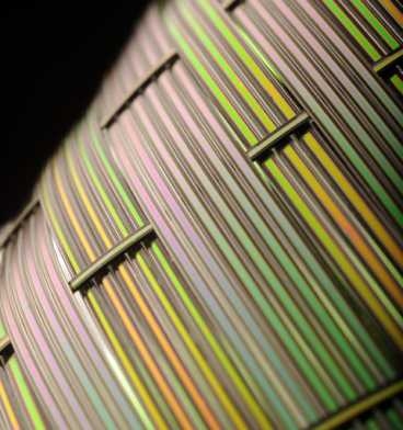 The Fink lab has demonstrated that it can manufacture acoustic fibers with flat surfaces, like those shown here, as well as fibers with circular cross sections. The flat fibers could prove particularly useful in acoustic imaging devices.