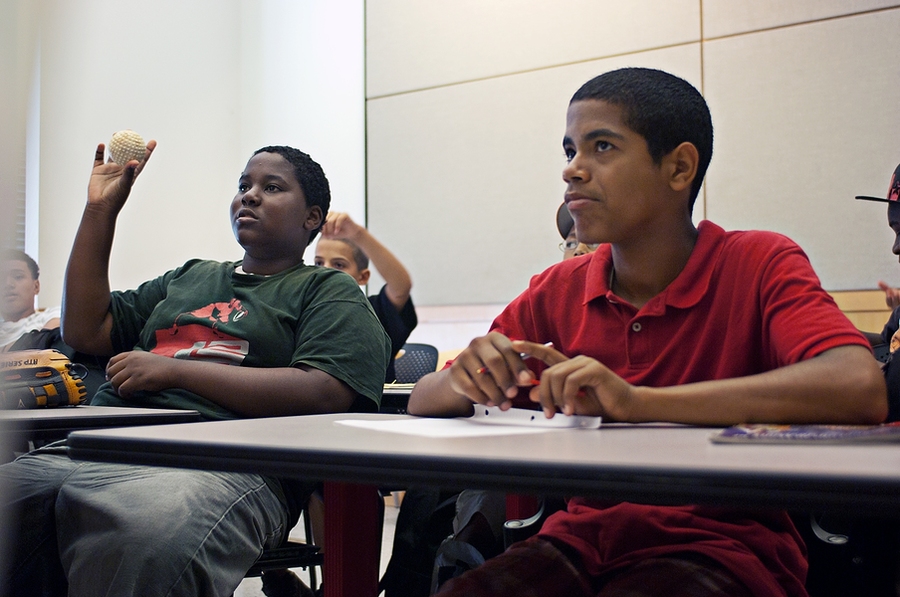 Students are shown a variety of balls of different sizes and materials and are asked to predict which will experience the most break when thrown at a target drawn on the blackboard.