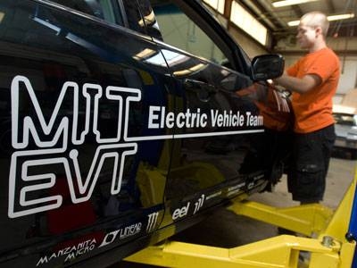 MIT Electric Vehicle Team member Radu Gogoana works on the conversion of a 2010 Mercury Milan to an all-electric powertrain.