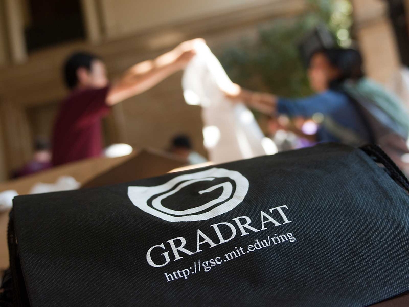 At an information booth in Lobby 10, students are encouraged to learn more about Brass Rat and Grad Rat graduation rings. At MIT, undergraduates receive their Brass Rats during their sophomore year, and the rings are personalized for each class. The Grad Rats are redesigned every five years.