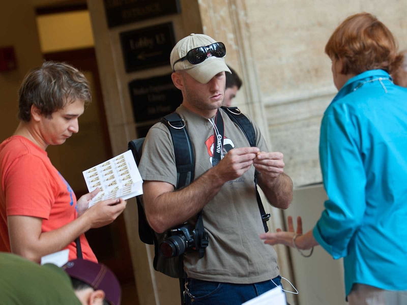 A sales representative, left, shows graduation rings to students.