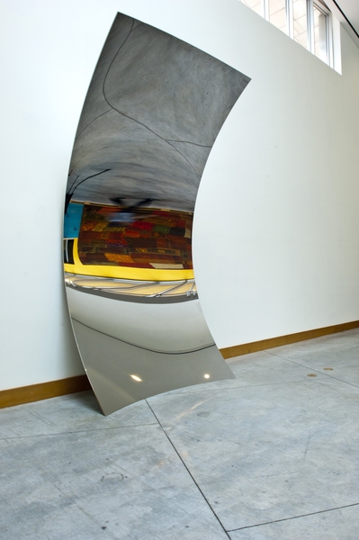 The Kapoor sculpture stands 16 feet tall and a little over 7 feet wide.