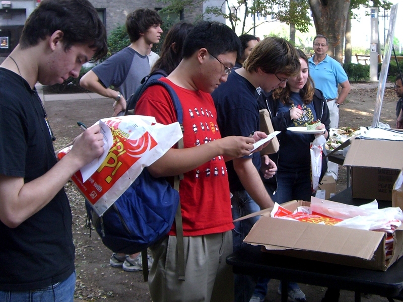 Students browse the free fire-safety giveaways at Campus Fire Safety Day, sponsored by the Division of Student Life and the Environmental Health and Safety office. Held in the East Campus Courtyard, the event also featured staff from MIT Medical, who provided health and wellness information, and staff from MIT’s Security and Emergency Management (SEMS), who talked about emergency preparedness.