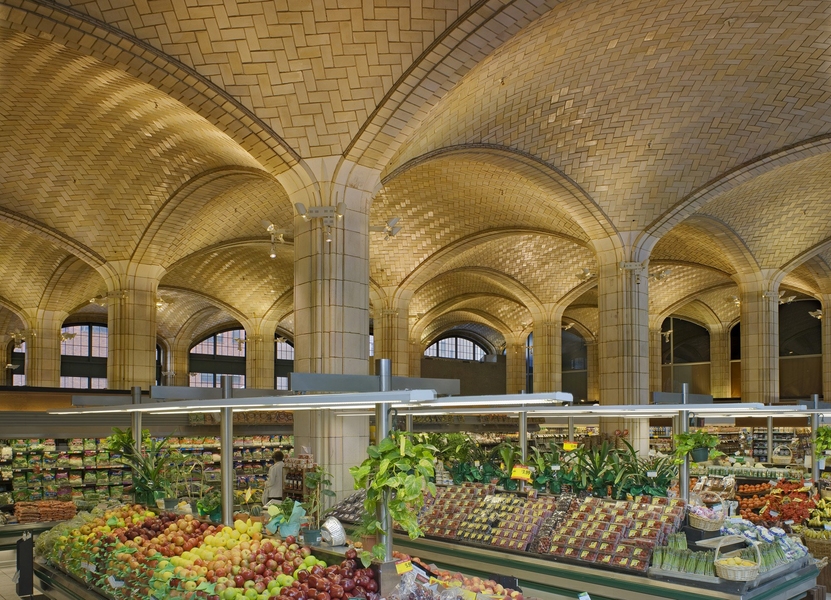 The vaulted arcade here gives a public market a soaring ceiling an observer described as “organic.”