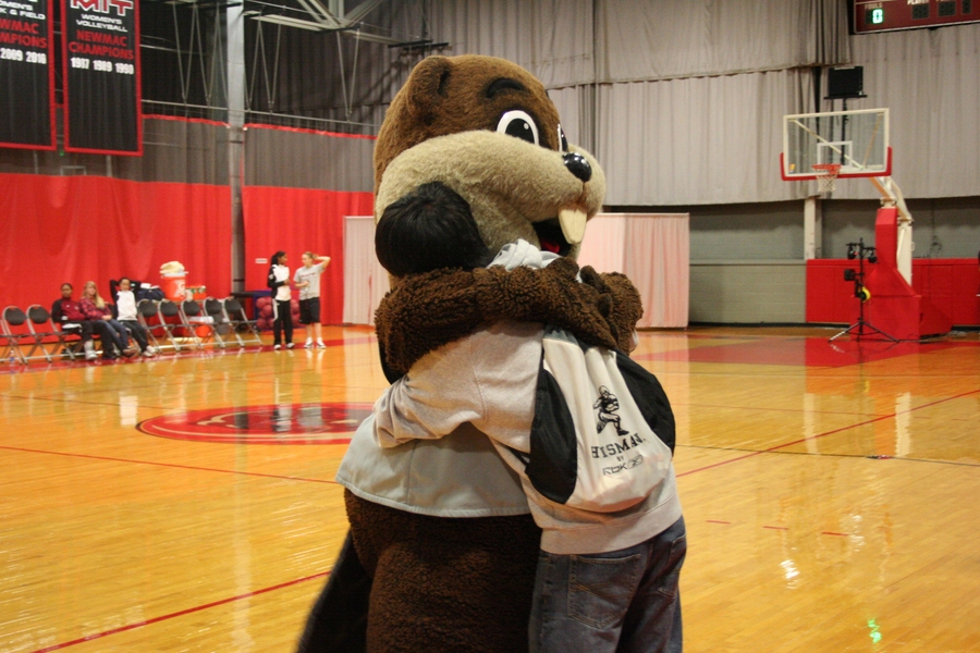Even mascots need hugs. A friendly student shows Tim the Beaver some love. 