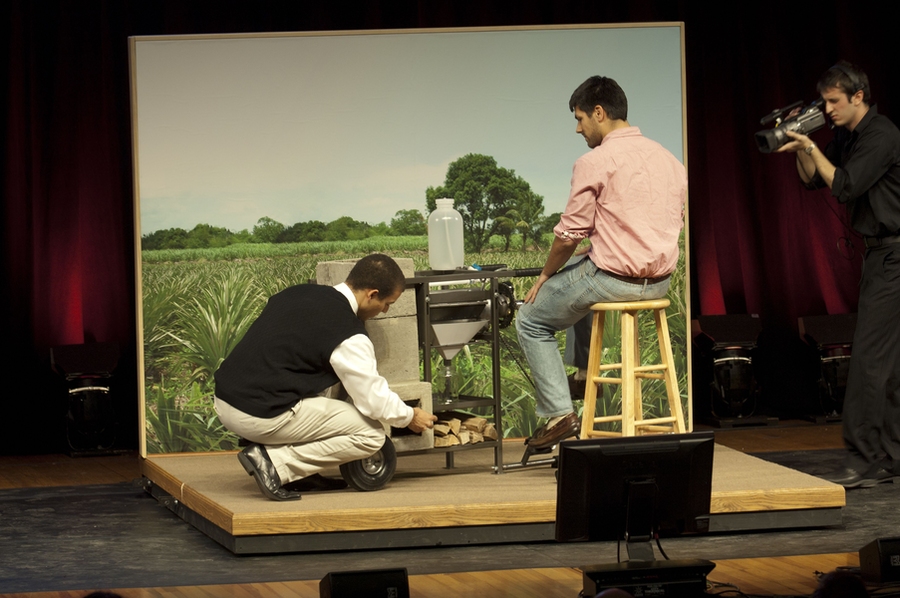 Each team delivered an 8-minute presentation followed by a 5-minute question and answer session. Here, Red team members demonstrate how to use their powdered milk dryer.