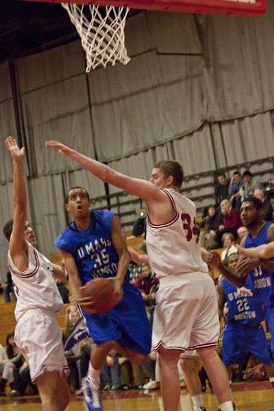 Paul (#35), a freshman at UMass-Boston and son of MIT head men's basketball coach Larry Anderson, goes in for a basket during the game.