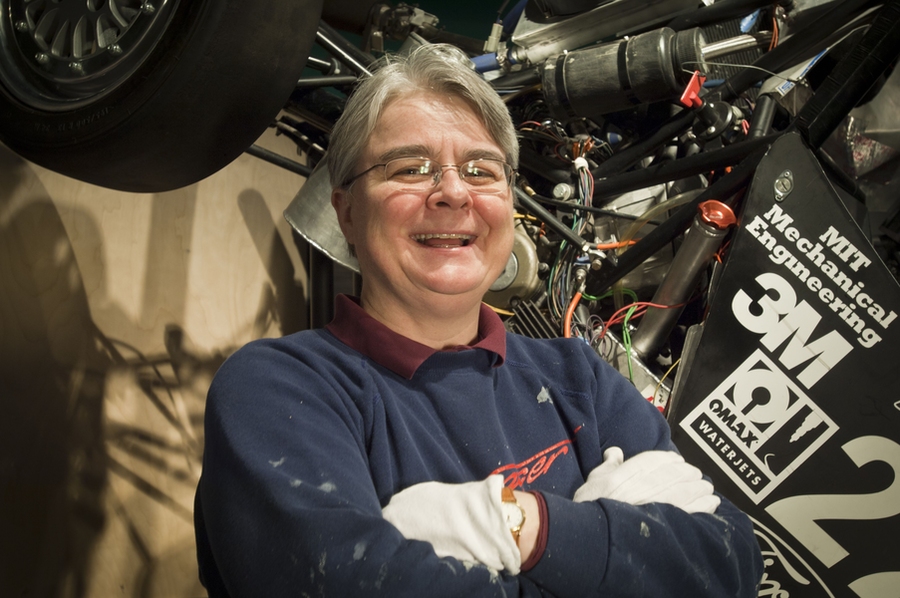 Deborah G. Douglas, the museum’s curator of science and technology, stands in front of a Formula SAE Race Car, which was designed, built and raced by MIT Motorsports.