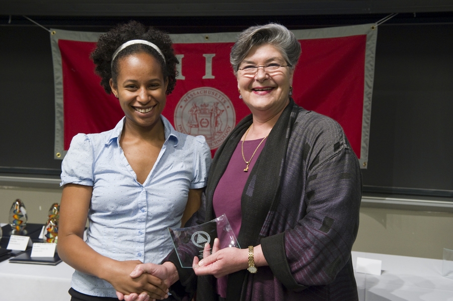 Judy Cole presents the 2010 Ronald E. McNair Scholarship Award to senior Aissata Nutzel.