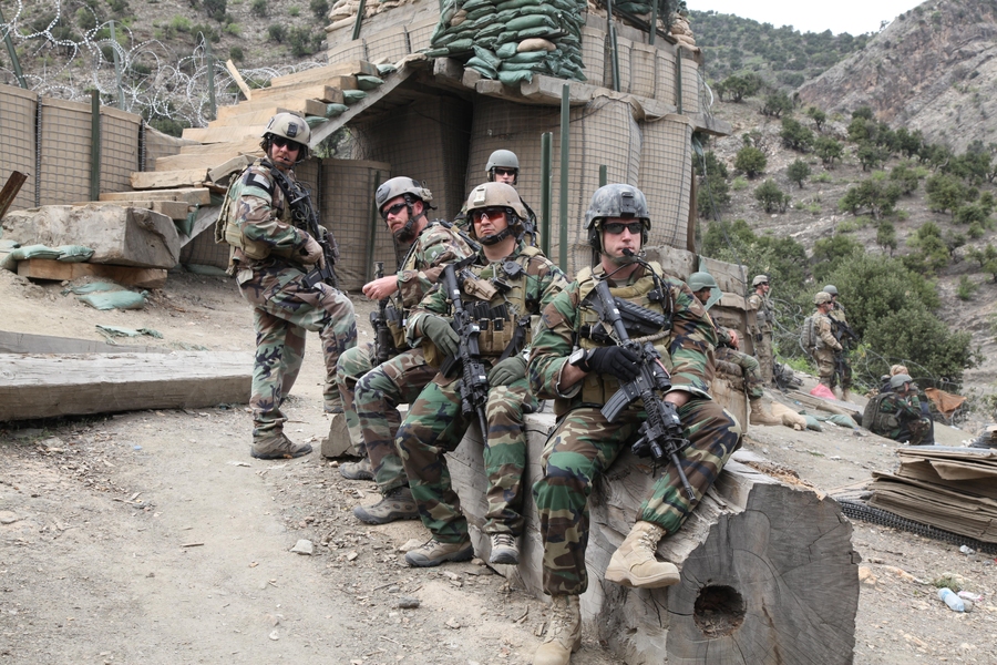 During a dismounted patrol in Eastern Afghanistan, Eaton sits with the other members of the Personal Security Detachment (PSD) for the Commander of ISAF.