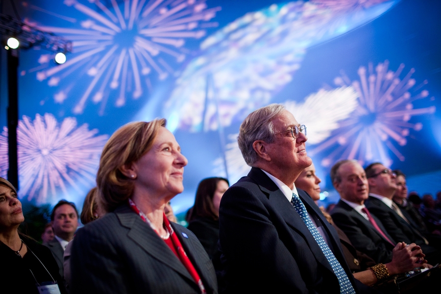MIT President Susan Hockfield listens on during the dedication ceremony with David Koch.