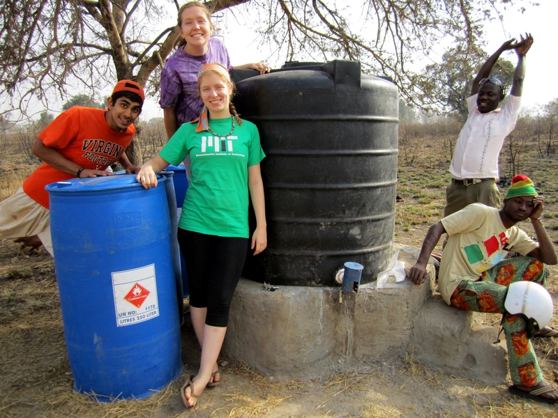 At left are Pranav Aurora, Shalyn Getz (back) and Sarah Fletcher (front), three of the Community Water Solutions (CWS) fellows. In the back right is Barihama, a cab driver and front right is Wahab, a translator for CWS. After a long day of work, the team relaxes by the newly completed water treatment center.