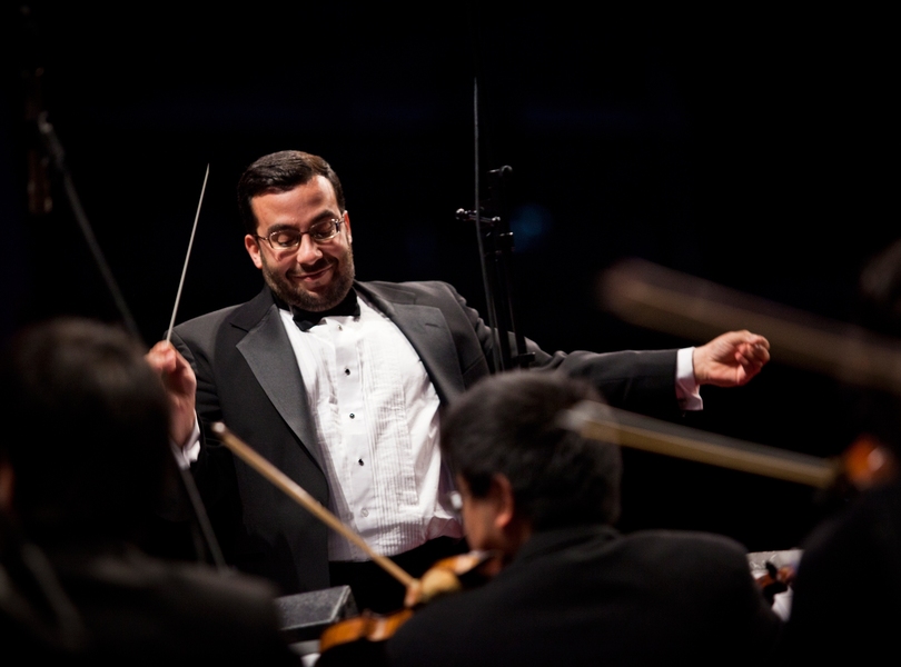 MITSO Director Adam Boyle conducts the orchestra in 'The Geniuses Among Us'