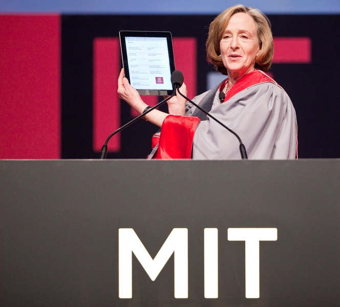 MIT President Susan Hockfield holds up the iCharter prior to signing.