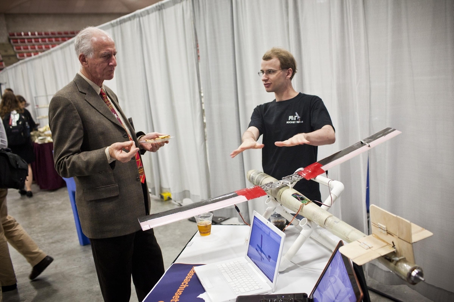 Jeffrey Hoffman, Professor of the Practice of Aerospace Engineering, gets up to speed on the latest designs by the MIT Rocket Team.