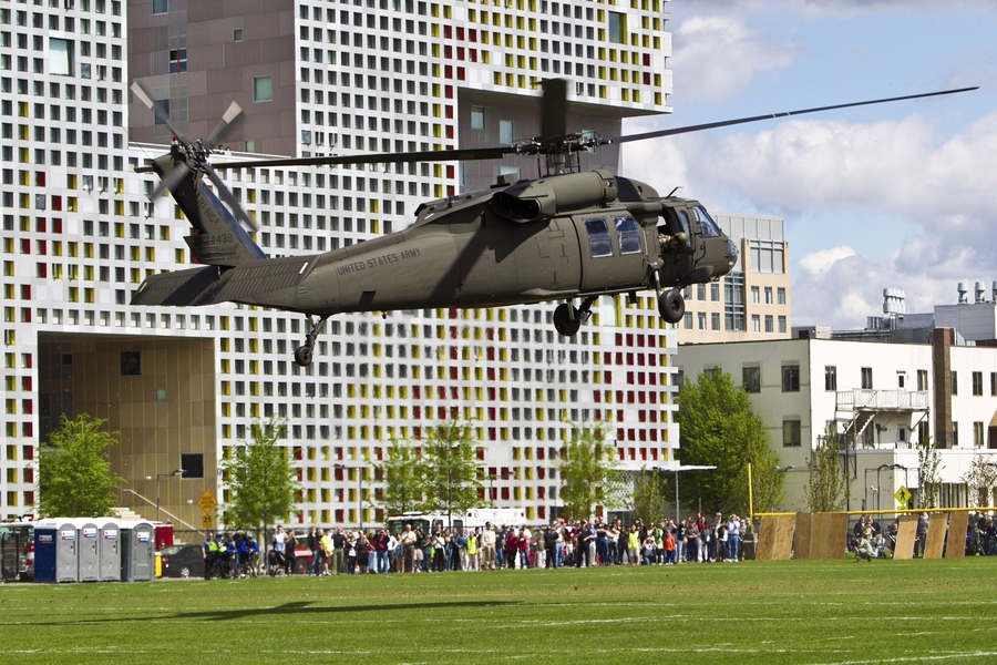 One of two Black Hawk helicopters from the Rhode Island National Guard land on campus for the open house.