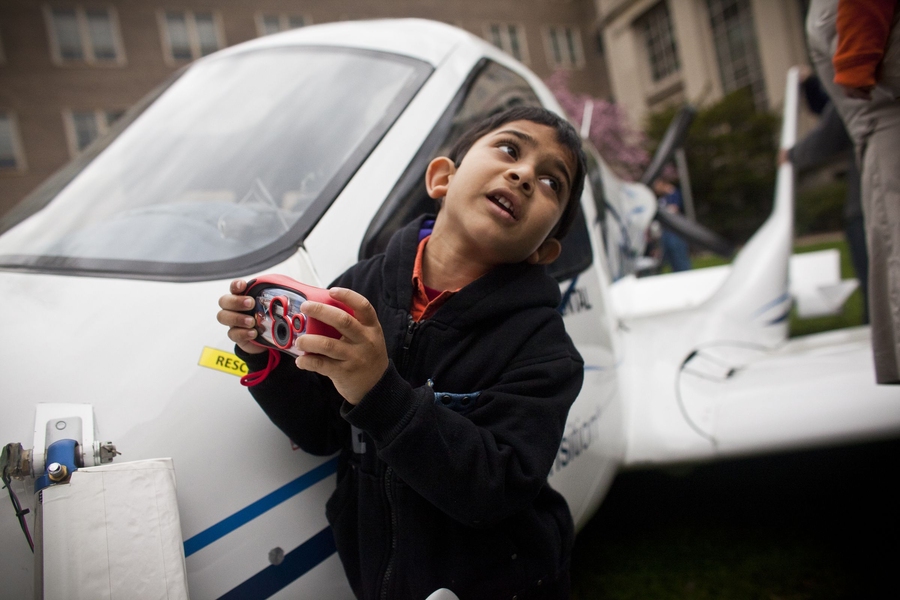 5-year-old Vikram Anantha takes photos of Terrafugia's experimental flying car.