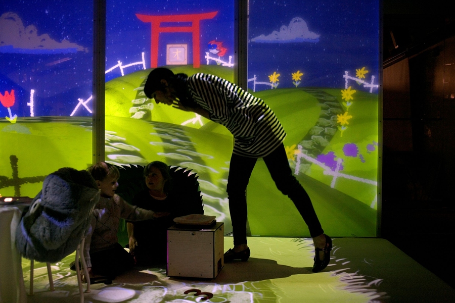 Julia Goldstein helps children in a demonstration of Playtime Computing, a project by MIT Media Lab graduate student David Robert.