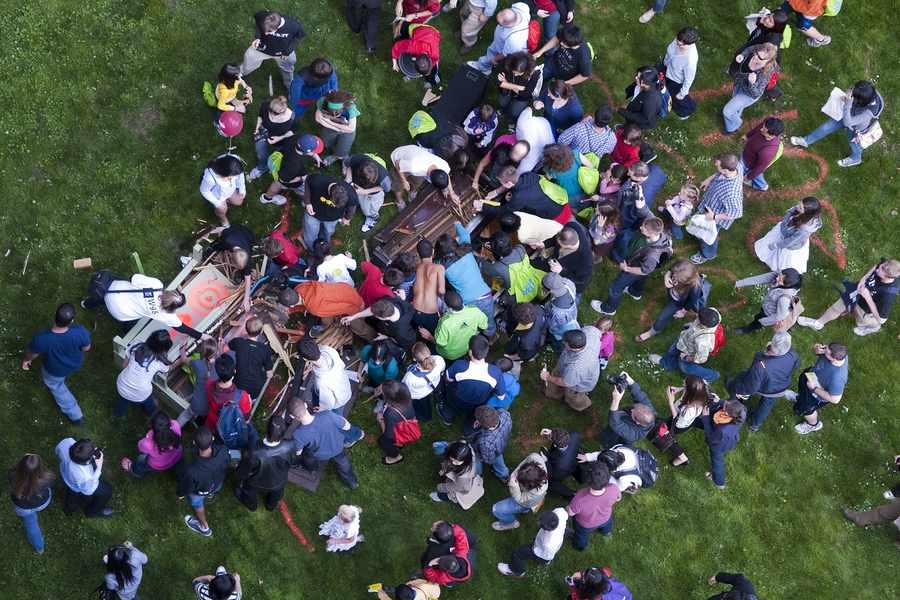 After the piano has dropped — and it is safe to enter the drop zone — the crowd rushes in to grab keys and other mementos.