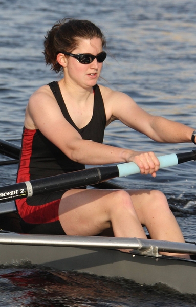 Tess Saxton-Fox rows in boat on water