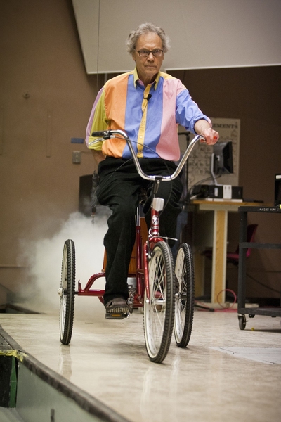 Lewin rides a tricycle powered by a fire extinguisher.