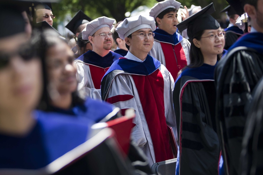 Doctoral students who received their hoods during a ceremony on Thursday received their diplomas during Friday's program.