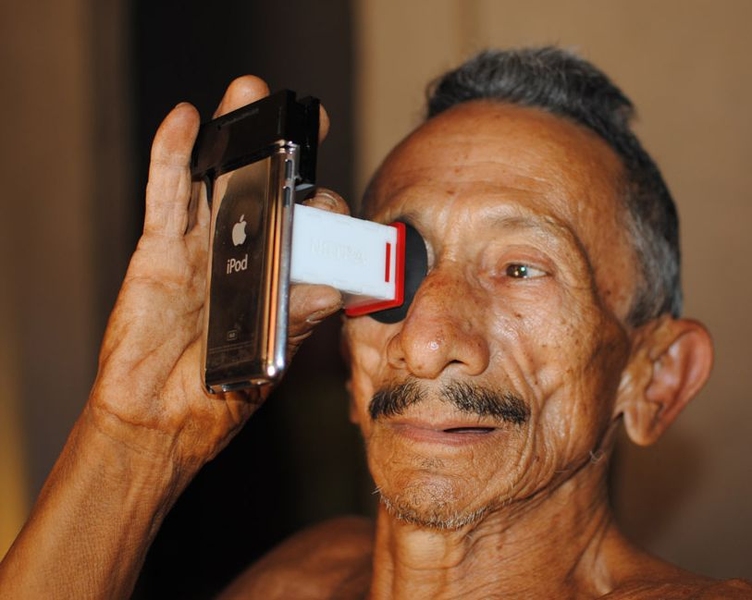 A man named Francisco takes an eye test in Brazil.