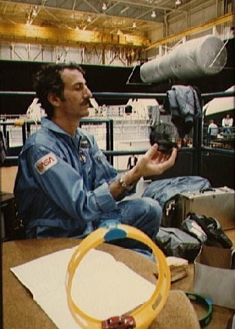 Jeffrey Hoffman, now Professor of the Practice in the Department of Aeronautics and Astronautics, rehearses a space test in 1985 with a Slinky, part of a 'Toys in Space' project.