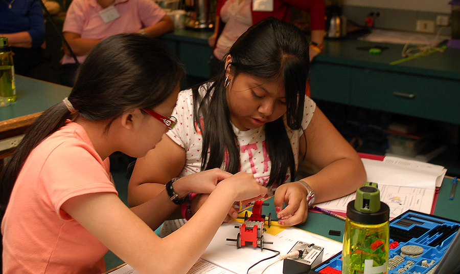 These girls use their new knowledge of gear ratios to design a LEGO® car that will go extra slow. 