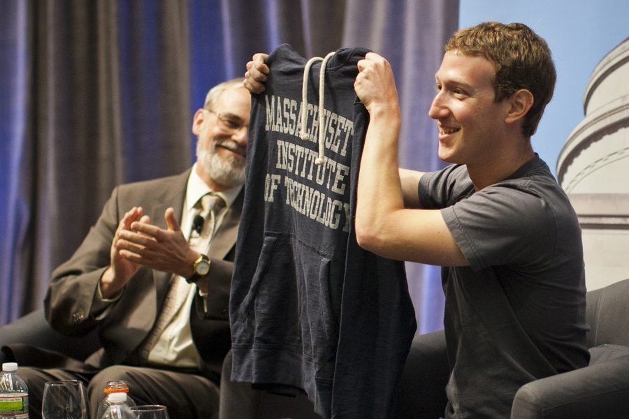 Zuckerberg holds up an MIT sweatshirt during his talk with students.