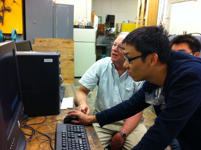 As part of MIT’s “Teach the Teachers” program, Hobby Shop Director Ken Stone instructed Jun on the finer points of computer-aided design. 