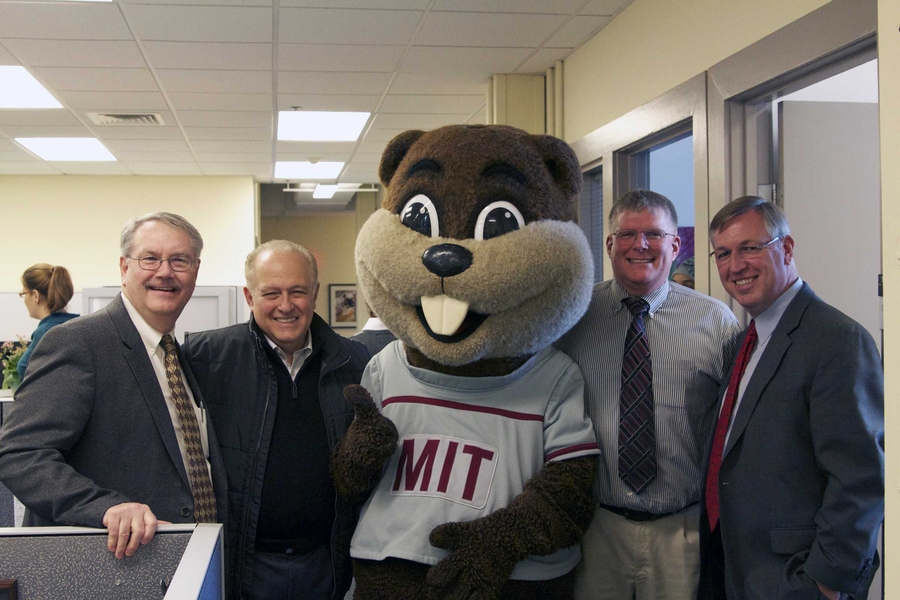 Phillip Walsh, director of Campus Activities Complex; Colombo; Tim the Beaver; Dennis Collins, director of Housing; and Humphreys all gave the thumbs up to the new space, which brought all four programs of Residential Life under one roof.