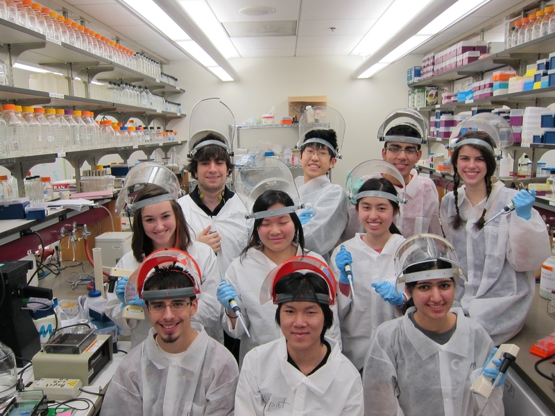 Mission accomplished! Dressed for the part and armed with pipettes, the team is proud of its accomplishments.