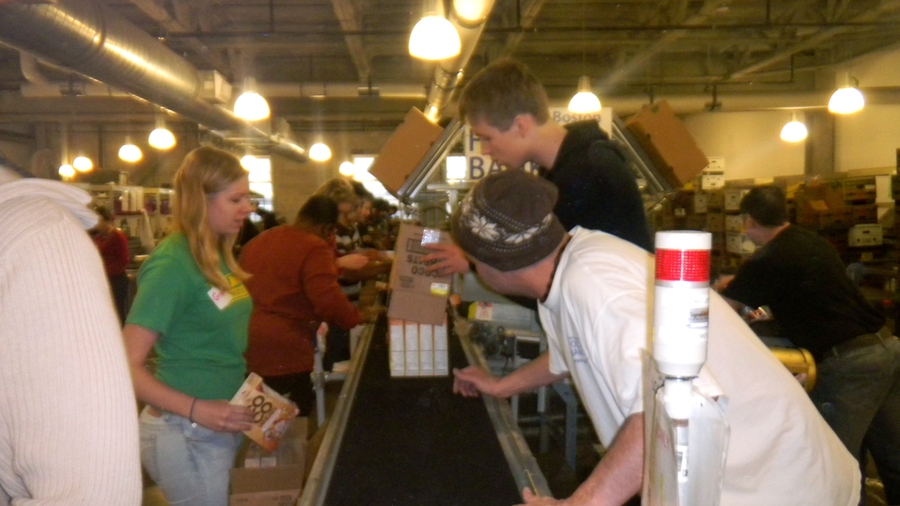 MIT volunteers sort and package groceries at The Greater Boston Food Bank.