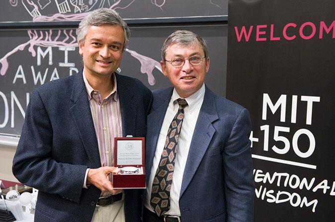 Professor Tom Kochan (Chair of the Faculty) presents the Everett Moore Baker Memorial Award to Professor Krishna Rajagopal (Associate Department Head & Professor of Physics).