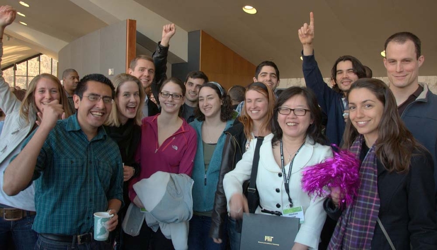 Colleagues and supporters of Hsinhwa Lee, recipient of the Serving the Client Award, cheer for her at the reception following the ceremony.