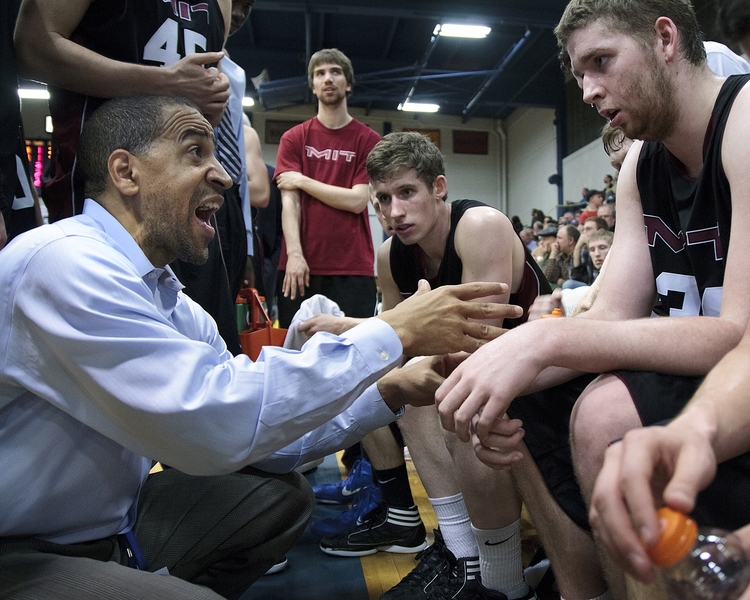 MIT's head coach Larry Anderson strategizes during a timeout with Karraker and Hollingsworth. In a battle of top defensive teams, MIT had the better night, holding Franklin & Marshall to its lowest point total of the season.