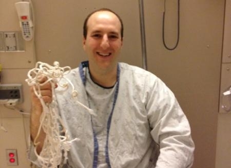 Goodman wears the net given to him from MIT's win against Staten Island in the third-round of the NCAA tournament. 
