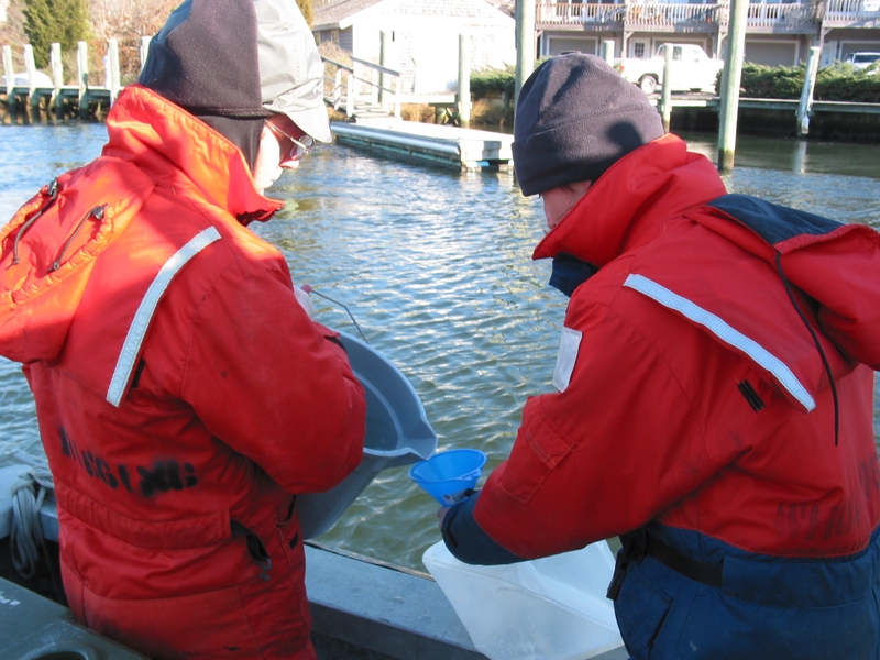 Processing water on the Childs River in Waquoit Bay, Mass., during the radon-mapping project. Co-Principal Investigator Henrieta Dulaiova is on the right.