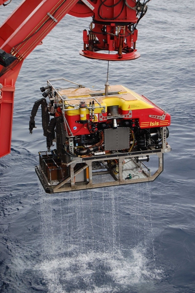 The Isis ROV is pulled out of the water, carrying rock samples collected from the ocean bottom.