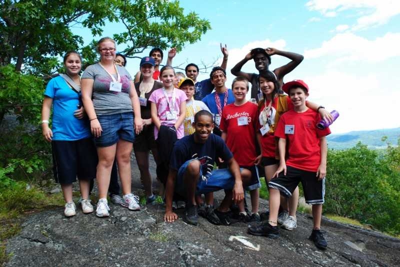 Campers from our 13-year-old unit at Camp Kesem hiking up to the top of a hill.