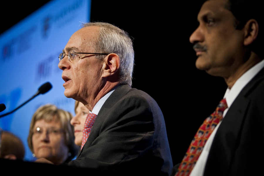 EdX President Anant Agarwal (right) listens as MIT Provost L. Rafael Reif answers journalists' questions.