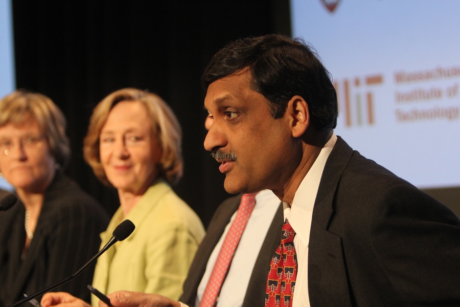Harvard President Drew Faust and MIT President Susan Hockfield (rear) listen as edX President Anant Agarwal answers a journalist's question at the press conference.