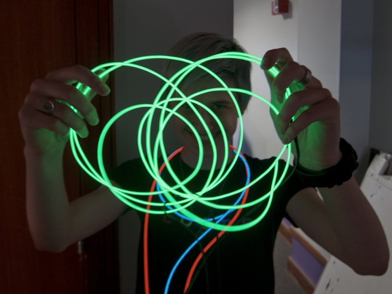Pauline Varley '15 shows off her electroluminescent wire (EL wire) in the East Campus dormitory, which often hosts construction, destruction and other hands-on activities.